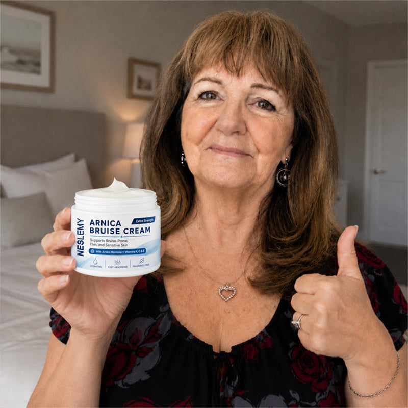 NESLEMY Arnica Bruise Cream customer holding product