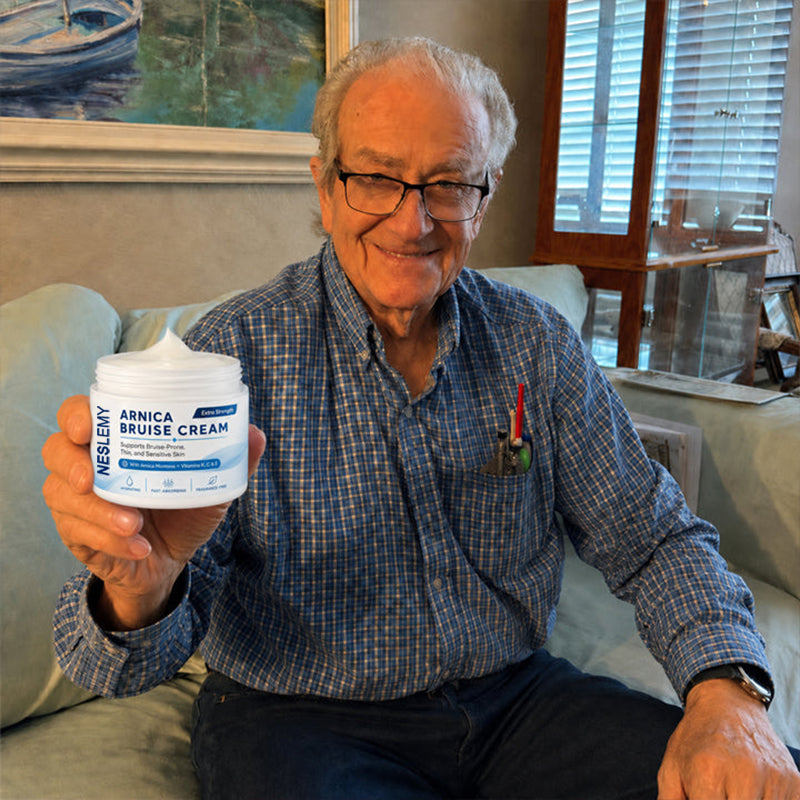 NESLEMY Arnica Bruise Cream customer holding the product